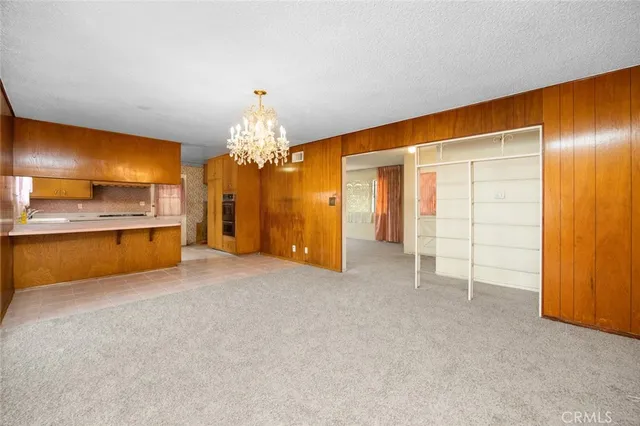 a view of a kitchen with a sink and a cabinet