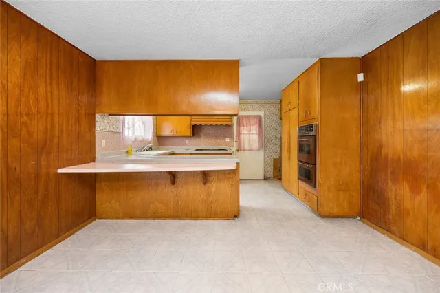 an empty room with a fireplace