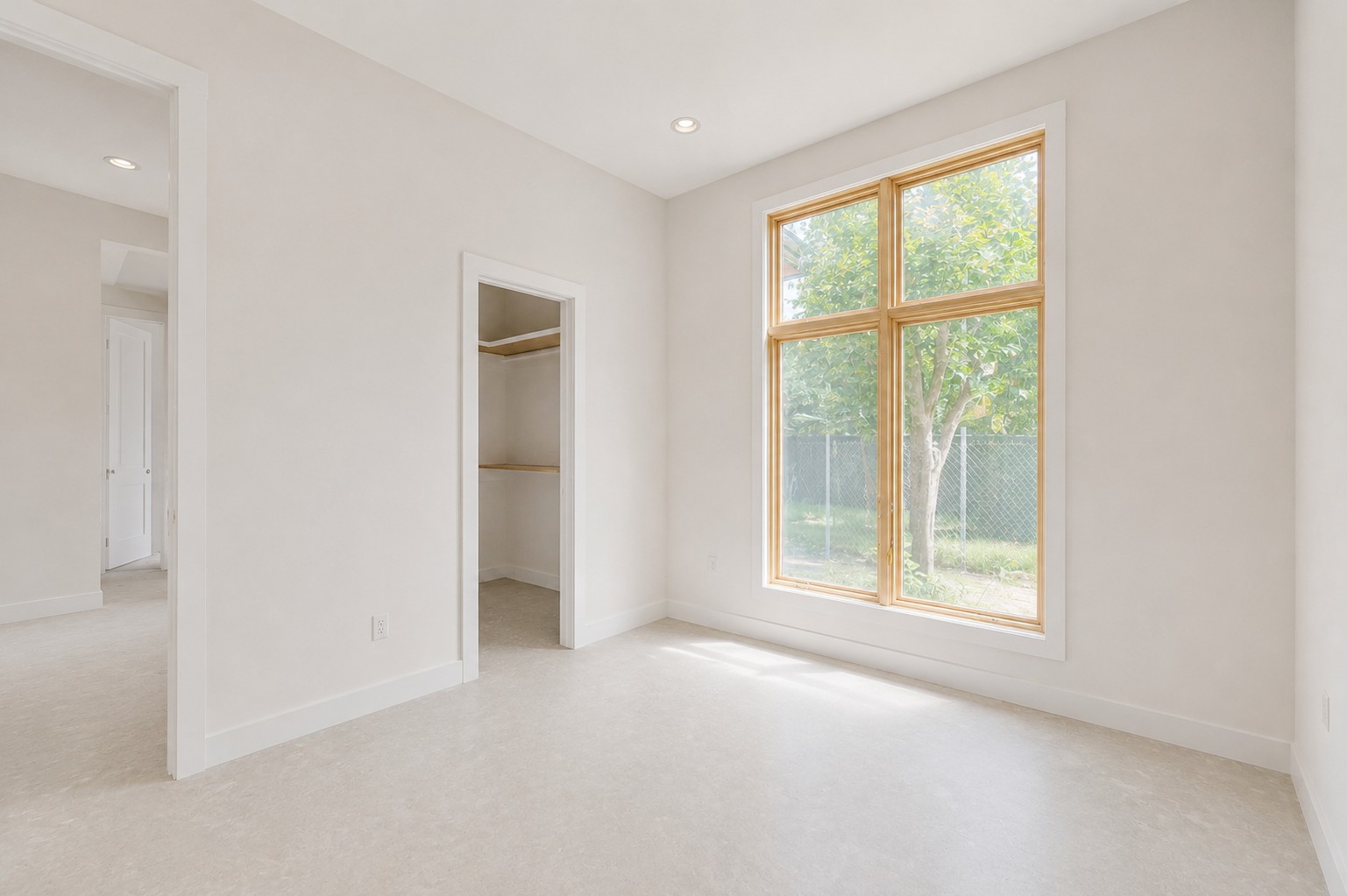 4603 Bucks Run Austin, TX 78744 - Photo 9 of 14 Bright room featuring a large wood-framed window, recessed lighting, and light-colored carpeting