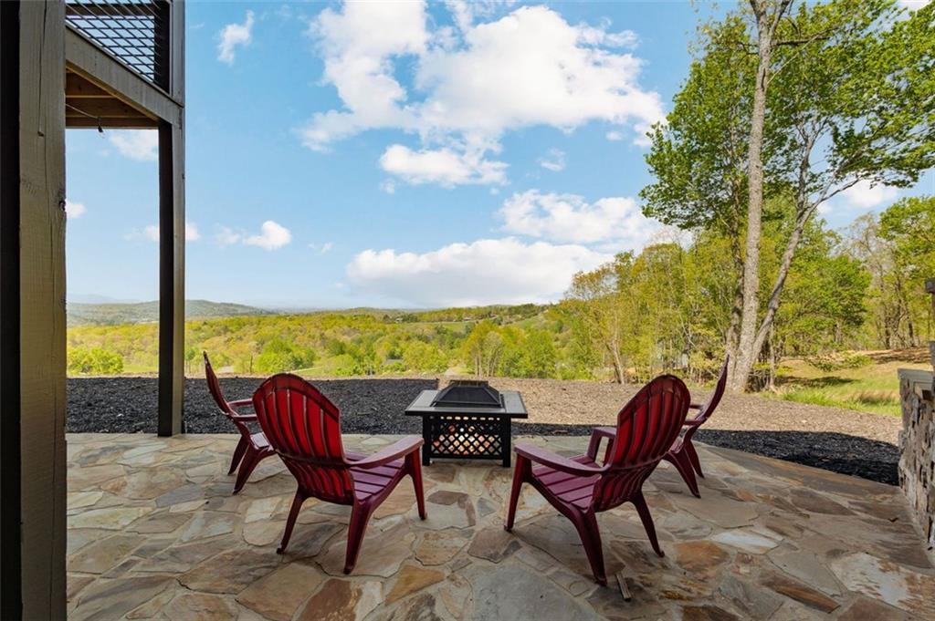 95 Upper Ridge Trail Blairsville, GA 30512 - Photo 18 of 71 a view of a chairs and table in the patio