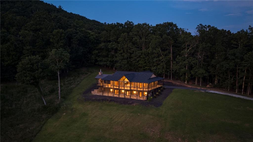 95 Upper Ridge Trail Blairsville, GA 30512 - Photo 3 of 71 a backyard of a house with table and chairs