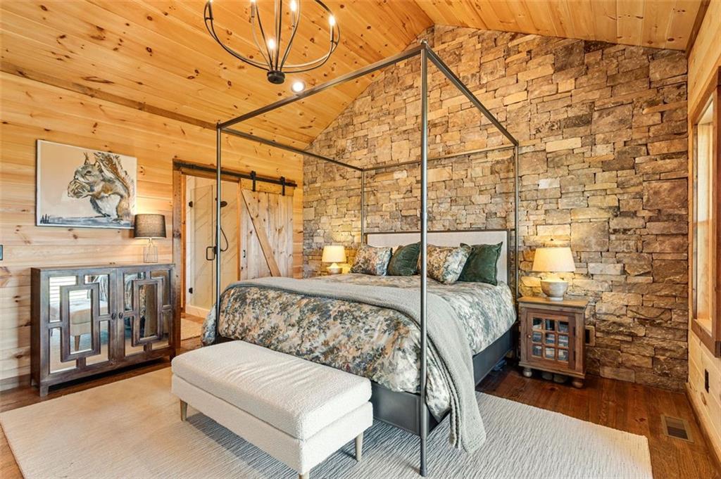 95 Upper Ridge Trail Blairsville, GA 30512 - Photo 38 of 71 a bed room with a bed and a chair