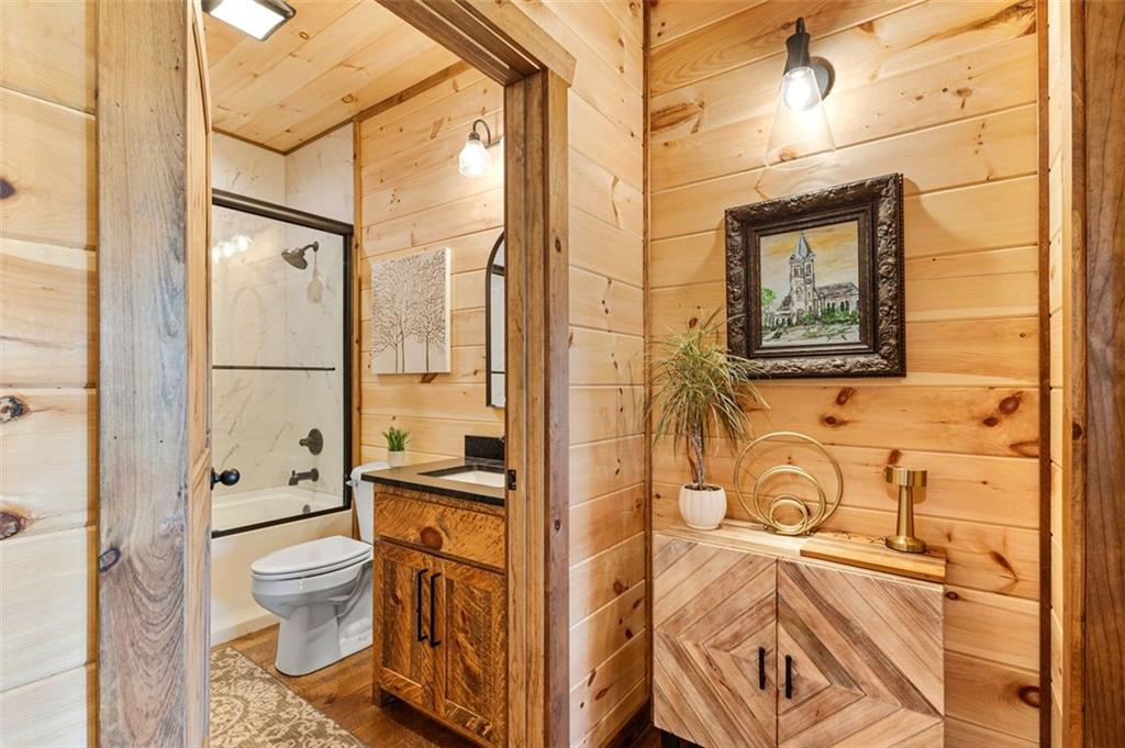 95 Upper Ridge Trail Blairsville, GA 30512 - Photo 45 of 71 a bathroom with a granite countertop toilet sink and shower