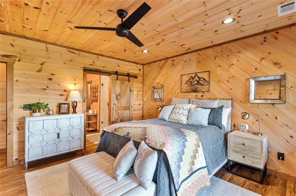 95 Upper Ridge Trail Blairsville, GA 30512 - Photo 53 of 71 a bed room with a bed and a couch