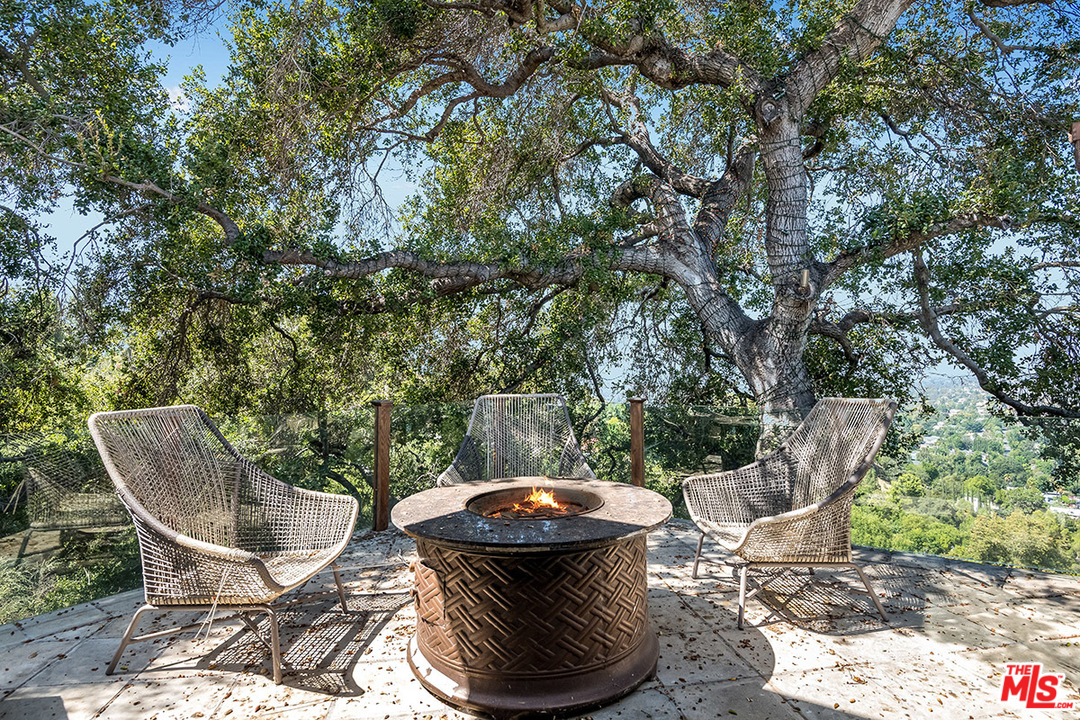 11458 Laurelcrest Road Studio City, CA 91604 - Photo 12 of 30 a patio with table and chairs and potted plants