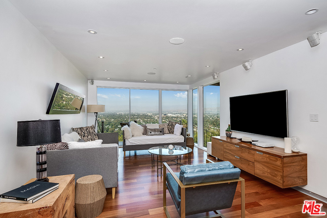 11458 Laurelcrest Road Studio City, CA 91604 - Photo 16 of 30 a living room with furniture and a flat screen tv