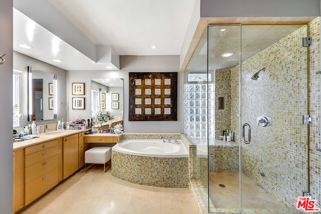 11458 Laurelcrest Road Studio City, CA 91604 - Photo 19 of 30 a spacious bathroom with a shower sink tub and mirror
