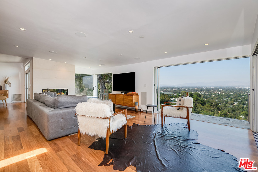 11458 Laurelcrest Road Studio City, CA 91604 - Photo 2 of 30 a living room with furniture and a flat screen tv