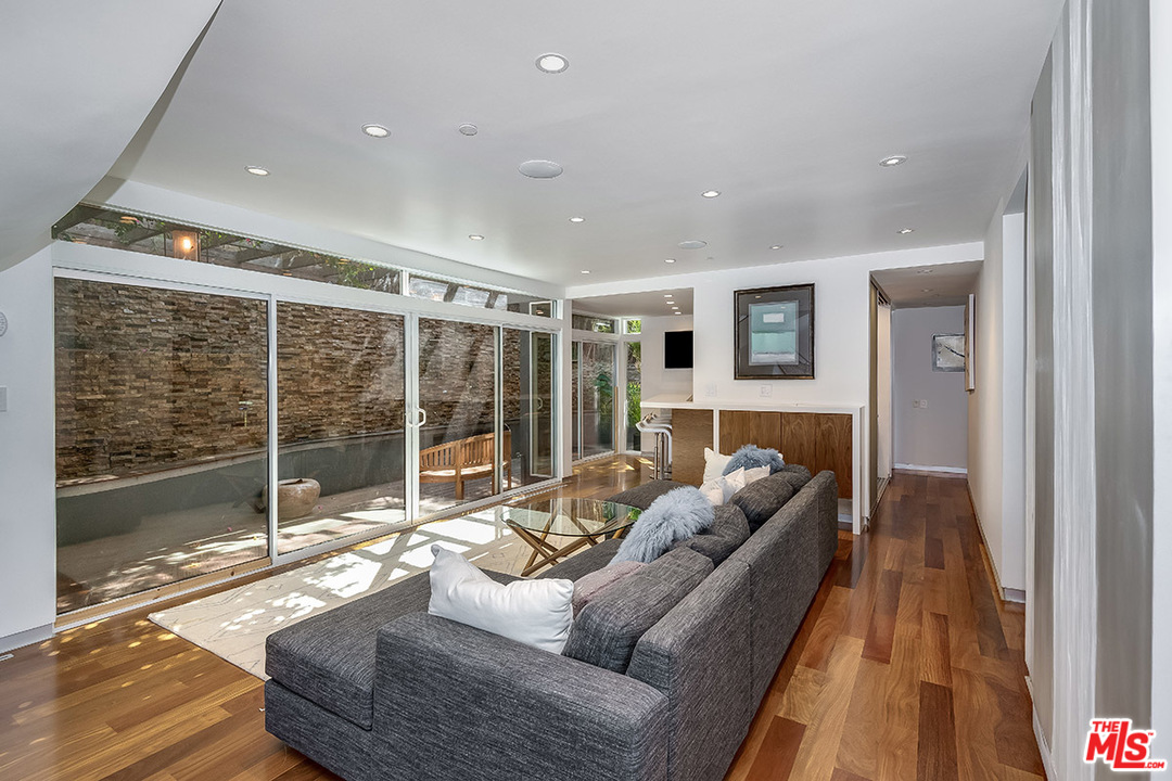11458 Laurelcrest Road Studio City, CA 91604 - Photo 21 of 30 a living room with furniture and a floor to ceiling window