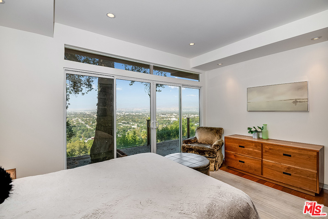 11458 Laurelcrest Road Studio City, CA 91604 - Photo 25 of 30 a bed room with a bed and a window