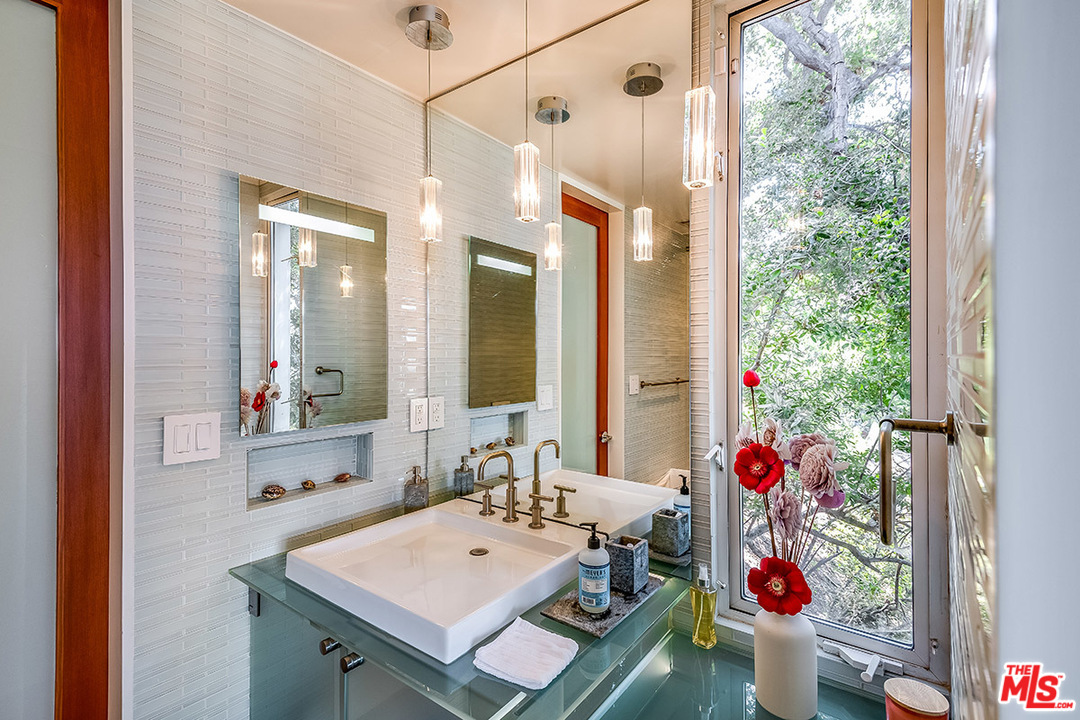 11458 Laurelcrest Road Studio City, CA 91604 - Photo 28 of 30 a bathroom with a sink a vanity and a mirror
