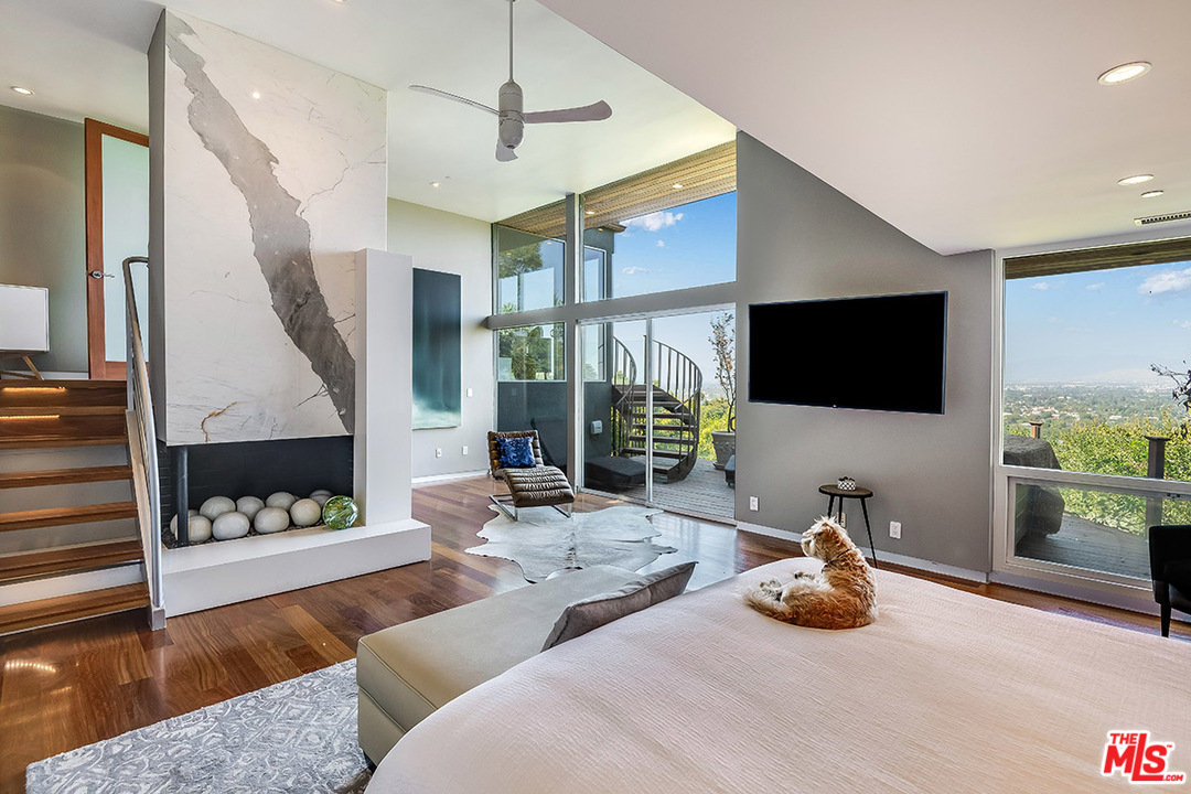 11458 Laurelcrest Road Studio City, CA 91604 - Photo 4 of 30 a living room with furniture and a flat screen tv