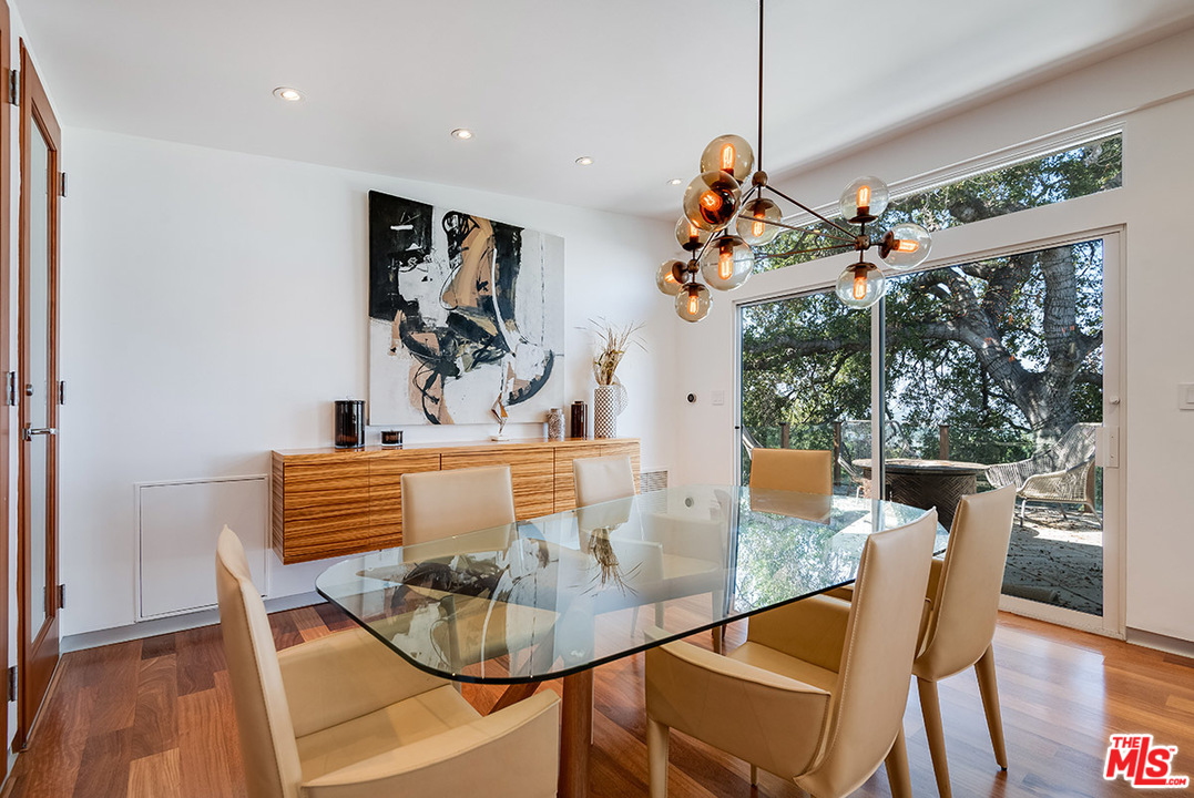 11458 Laurelcrest Road Studio City, CA 91604 - Photo 10 of 30 a view of a dining room with furniture window and wooden floor