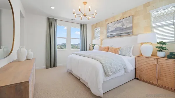 a bedroom with a bed and window