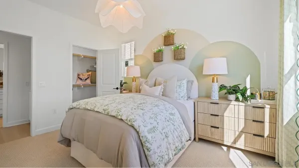 a bedroom with bed and window