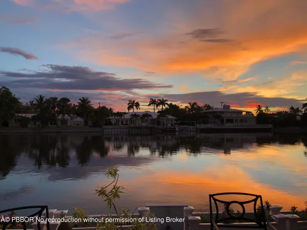 a view of a lake in middle of a residential building