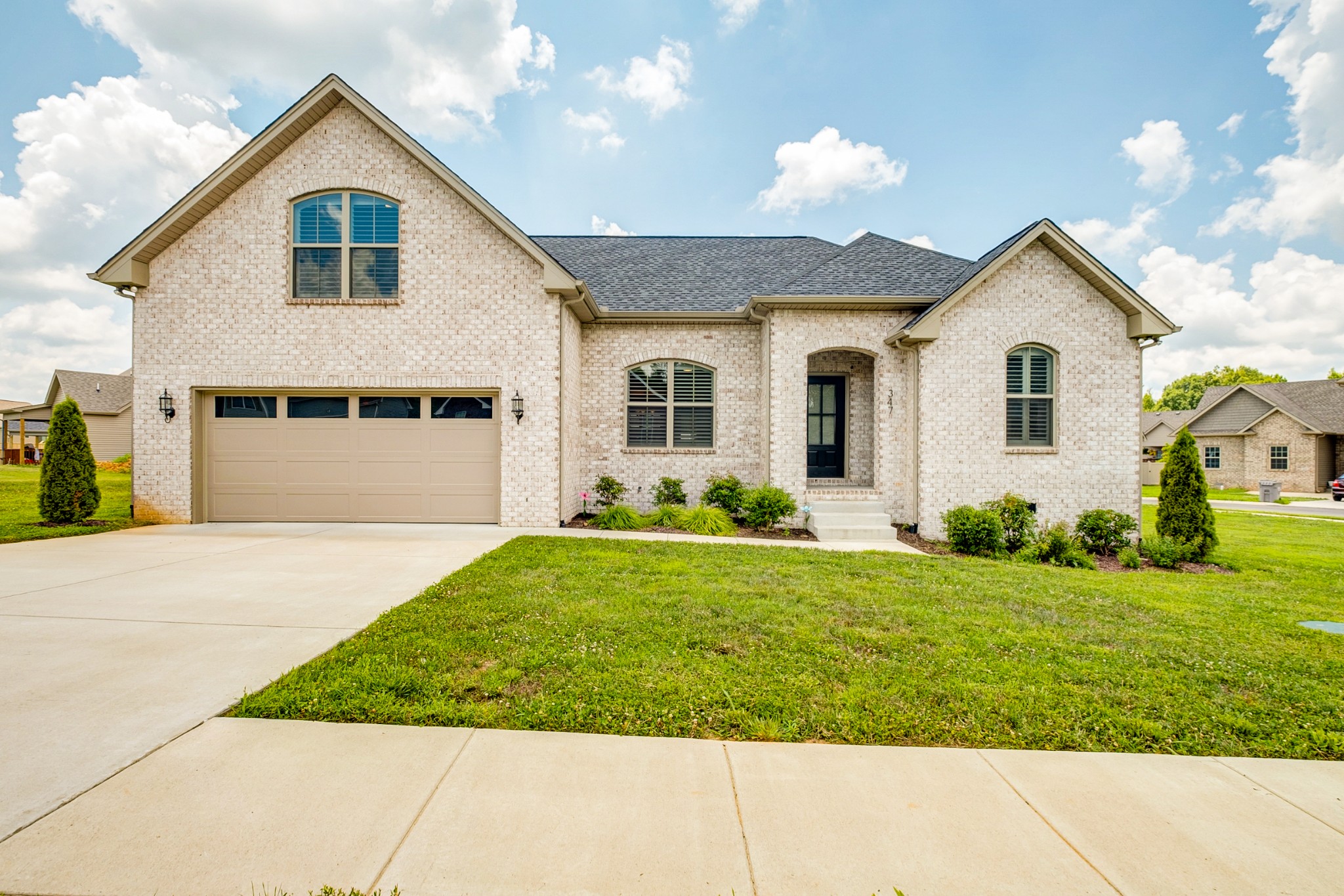 a view of front of house with a yard