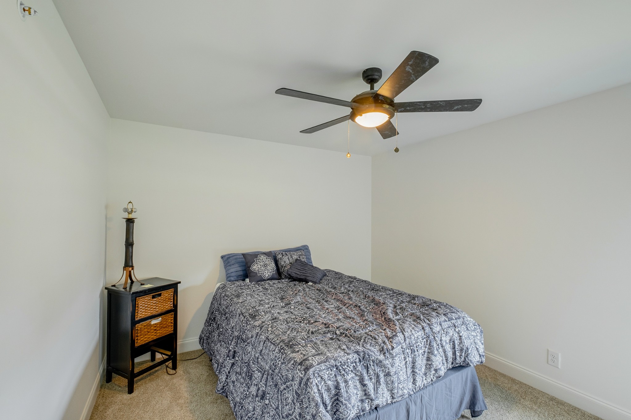 347 Preakness Circle Pleasant View, TN 37146 - Photo 17 of 29 a bedroom with a bed and a chandelier