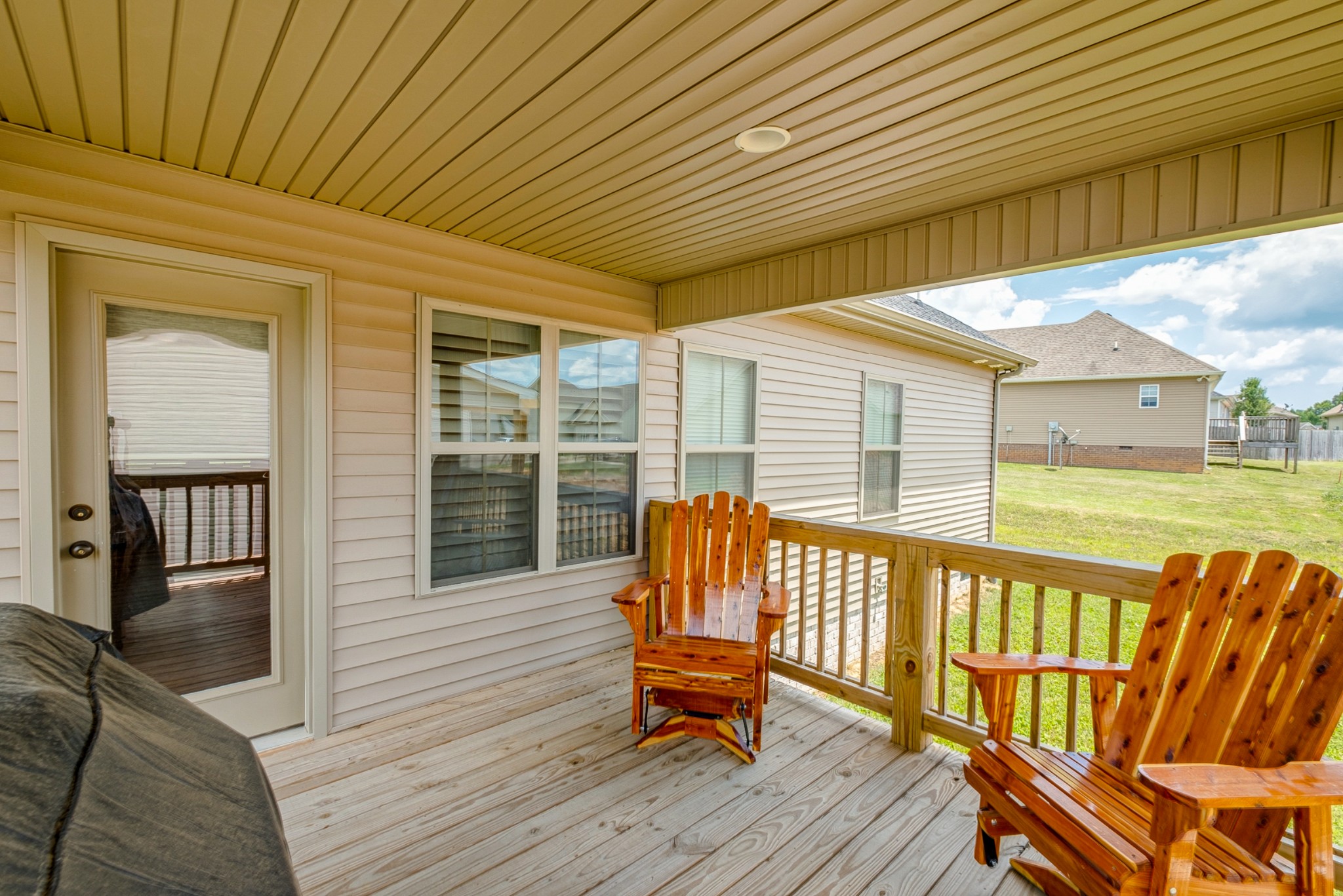 347 Preakness Circle Pleasant View, TN 37146 - Photo 26 of 29 a balcony with wooden floor table and chairs