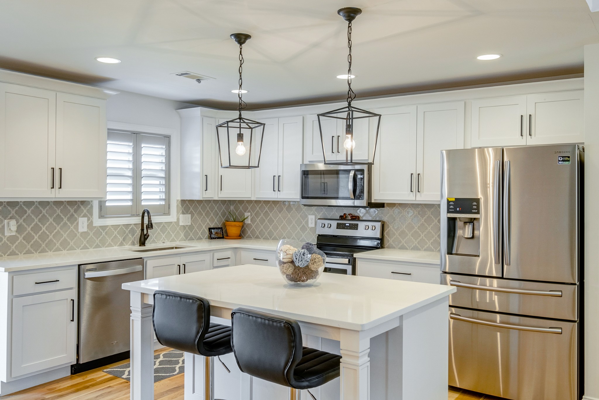347 Preakness Circle Pleasant View, TN 37146 - Photo 3 of 29 a kitchen with stainless steel appliances a sink a stove a refrigerator and white cabinets
