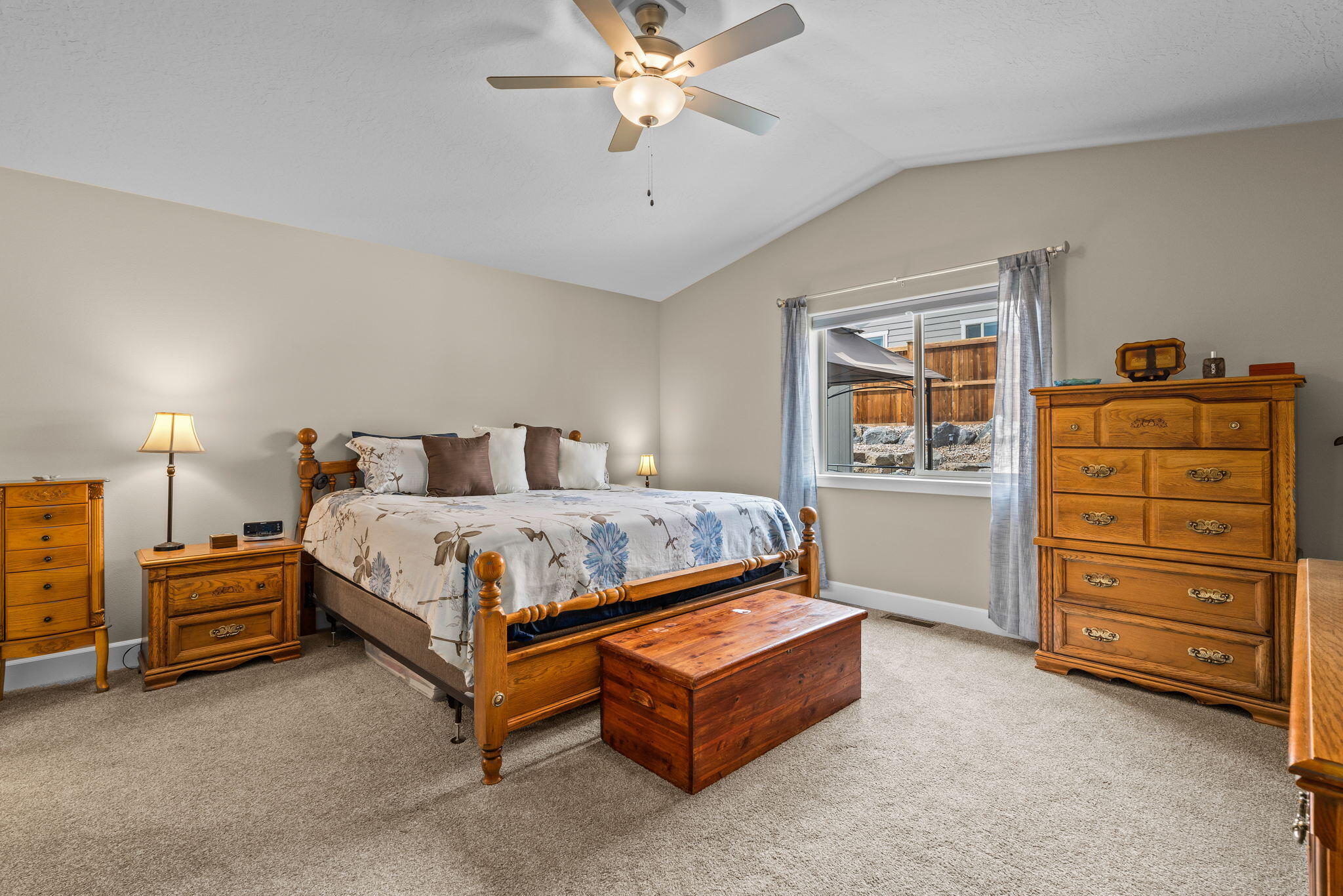 2546 Southwest Newberry Loop Redmond, OR 97756 - Photo 15 of 35 Vaulted ceilings with ceiling fan in Primary Bedroom.
