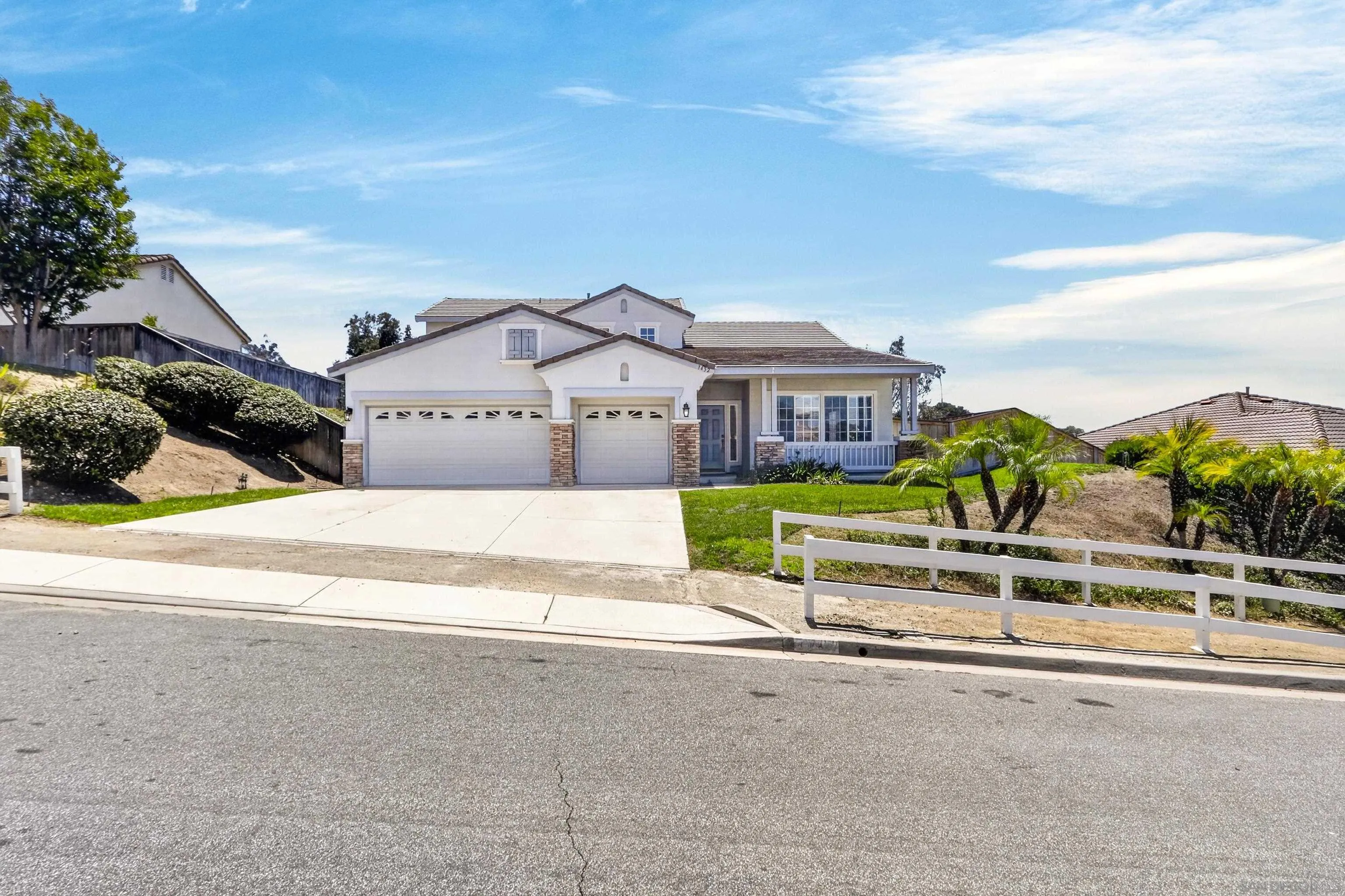 1432 Belmont Park Road Oceanside, CA 92057 - Photo 4 of 54 front view of a house with a bench in front of it