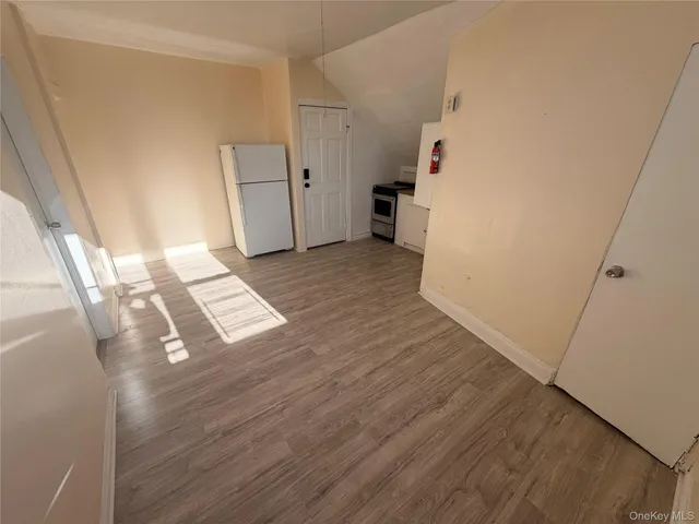 a view of kitchen and wooden floor