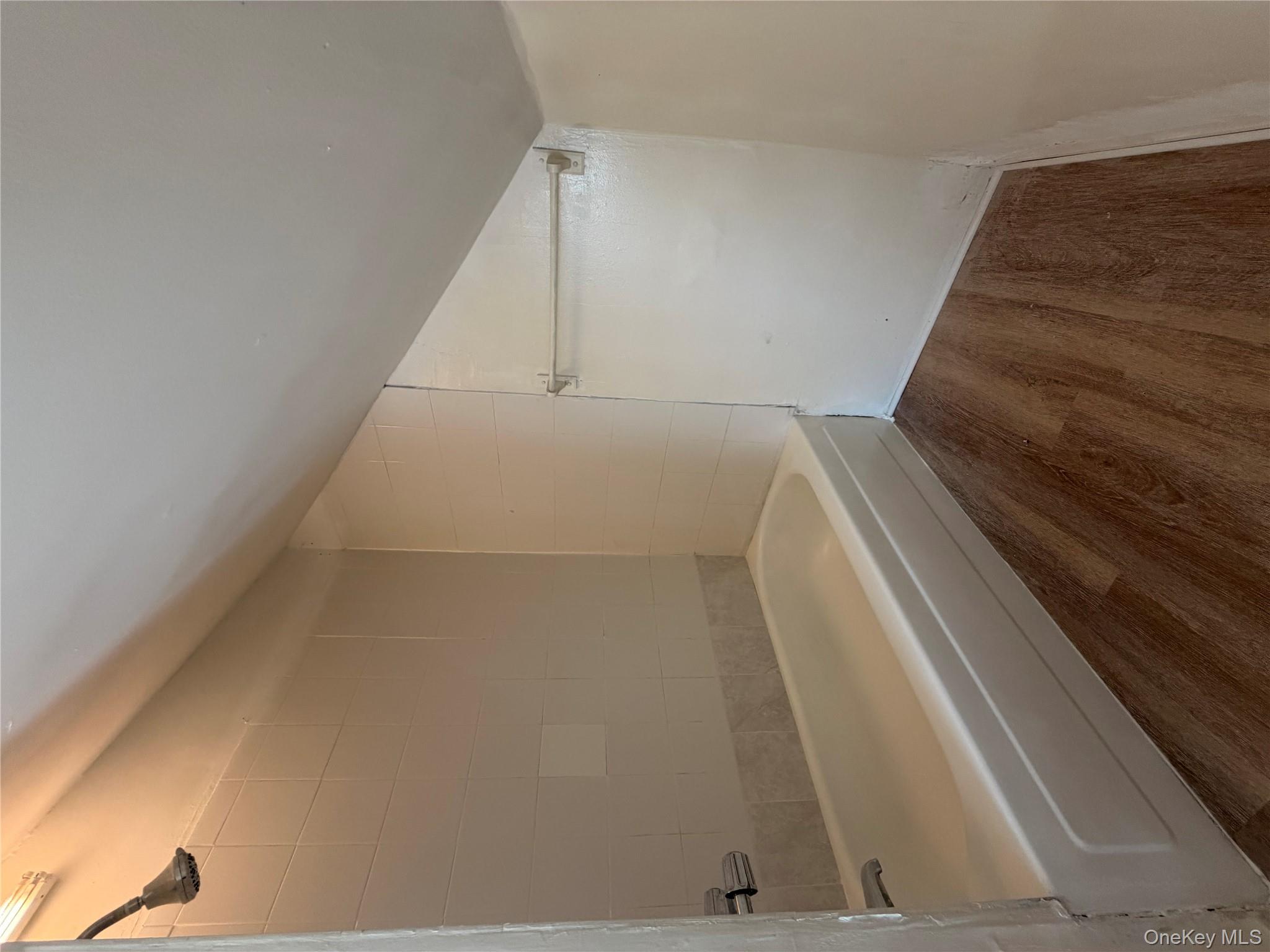 315 South 4th Avenue, Unit 3 Mount Vernon, NY 10550 - Photo 8 of 10 a bathroom with a bathtub and shower