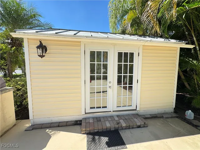 a view of a house with a door and a window