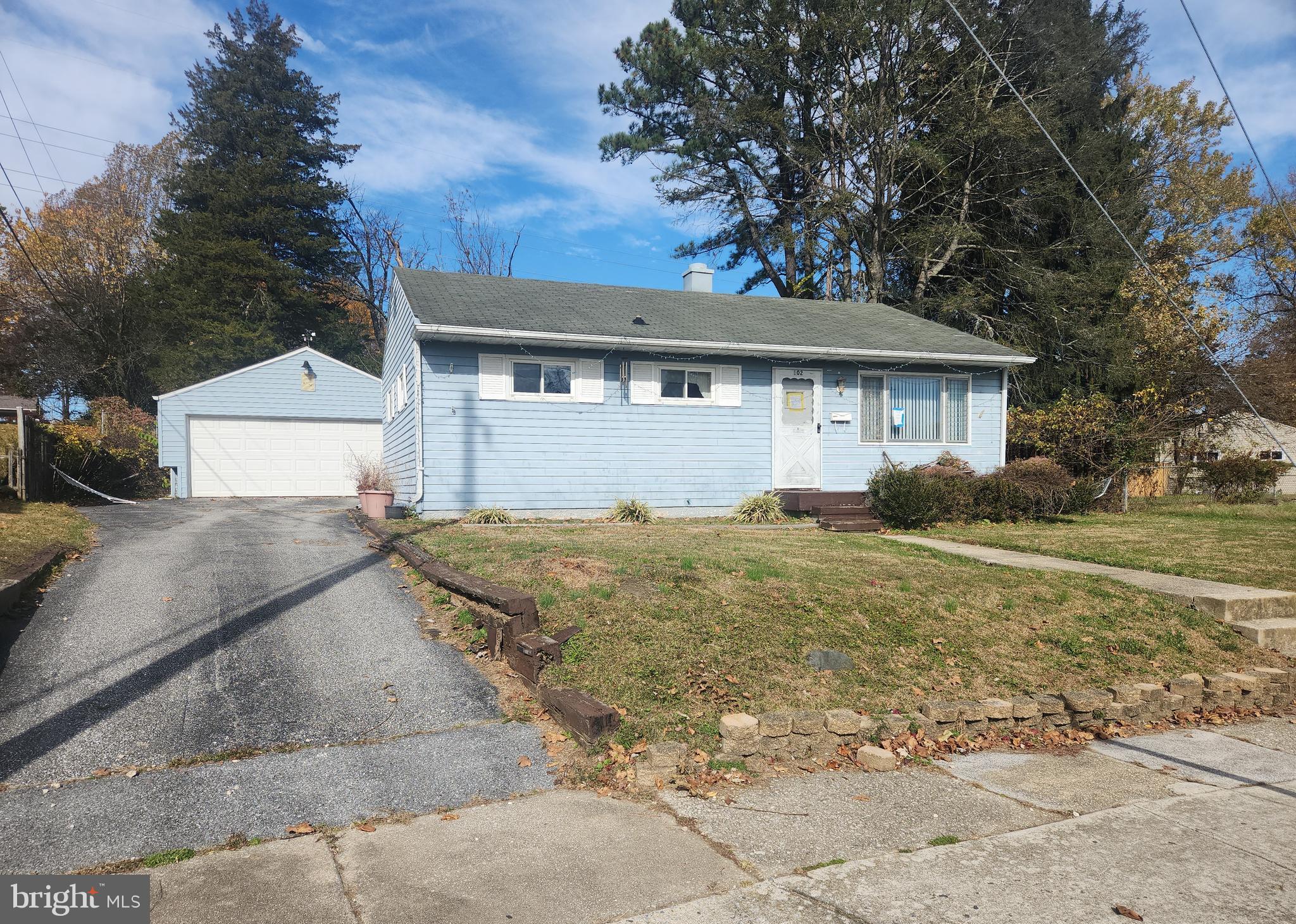 102 Cedarmere Road Owings Mills, MD 21117 - Photo 1 of 14 a front view of a house with a yard and garage