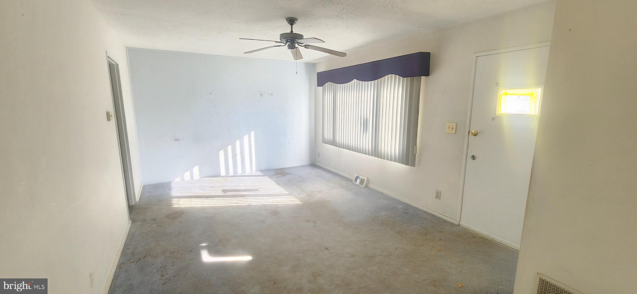 102 Cedarmere Road Owings Mills, MD 21117 - Photo 3 of 14 a view of an empty room with a window
