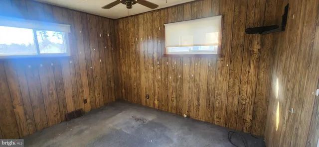 a view of a hallway with a wooden door
