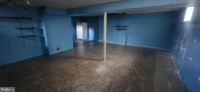 a view of a hallway with wooden shelves