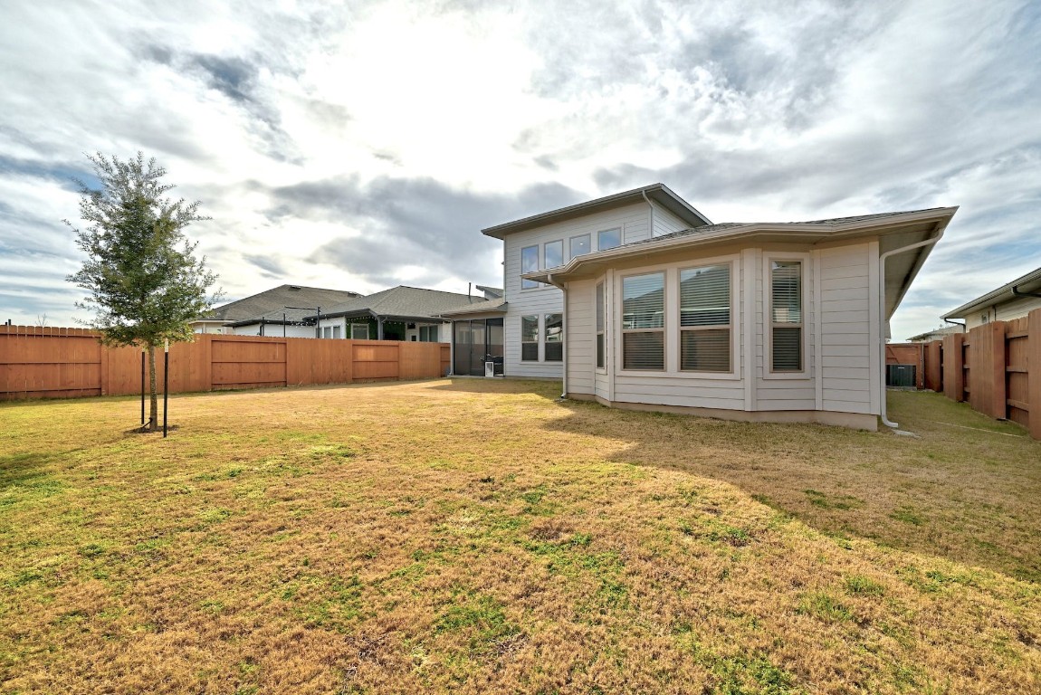8509 Silverthorne Street Austin, TX 78744 - Photo 31 of 39 a house with yard in front of it