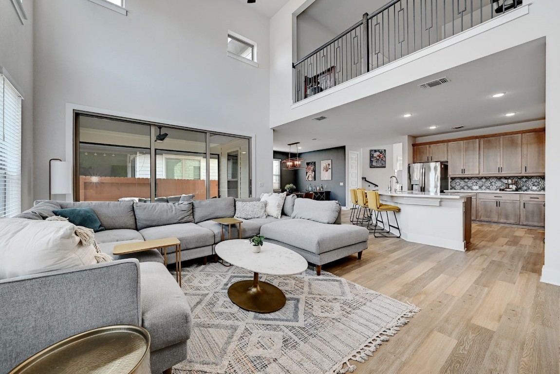 8509 Silverthorne Street Austin, TX 78744 - Photo 4 of 39 a living room with furniture and view of kitchen