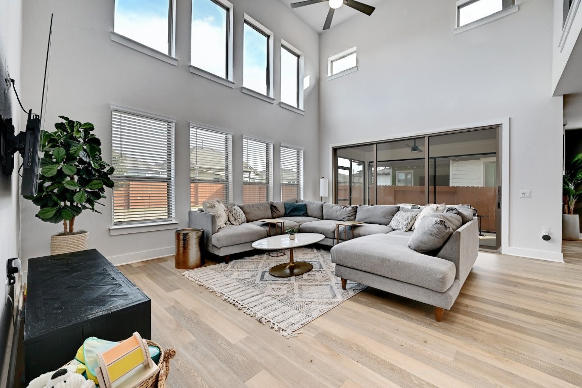 8509 Silverthorne Street Austin, TX 78744 - Photo 5 of 39 a living room with furniture or couch and a potted plant