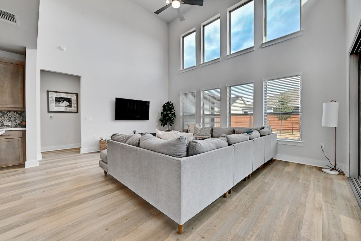 8509 Silverthorne Street Austin, TX 78744 - Photo 7 of 39 a living room with furniture and a flat screen tv