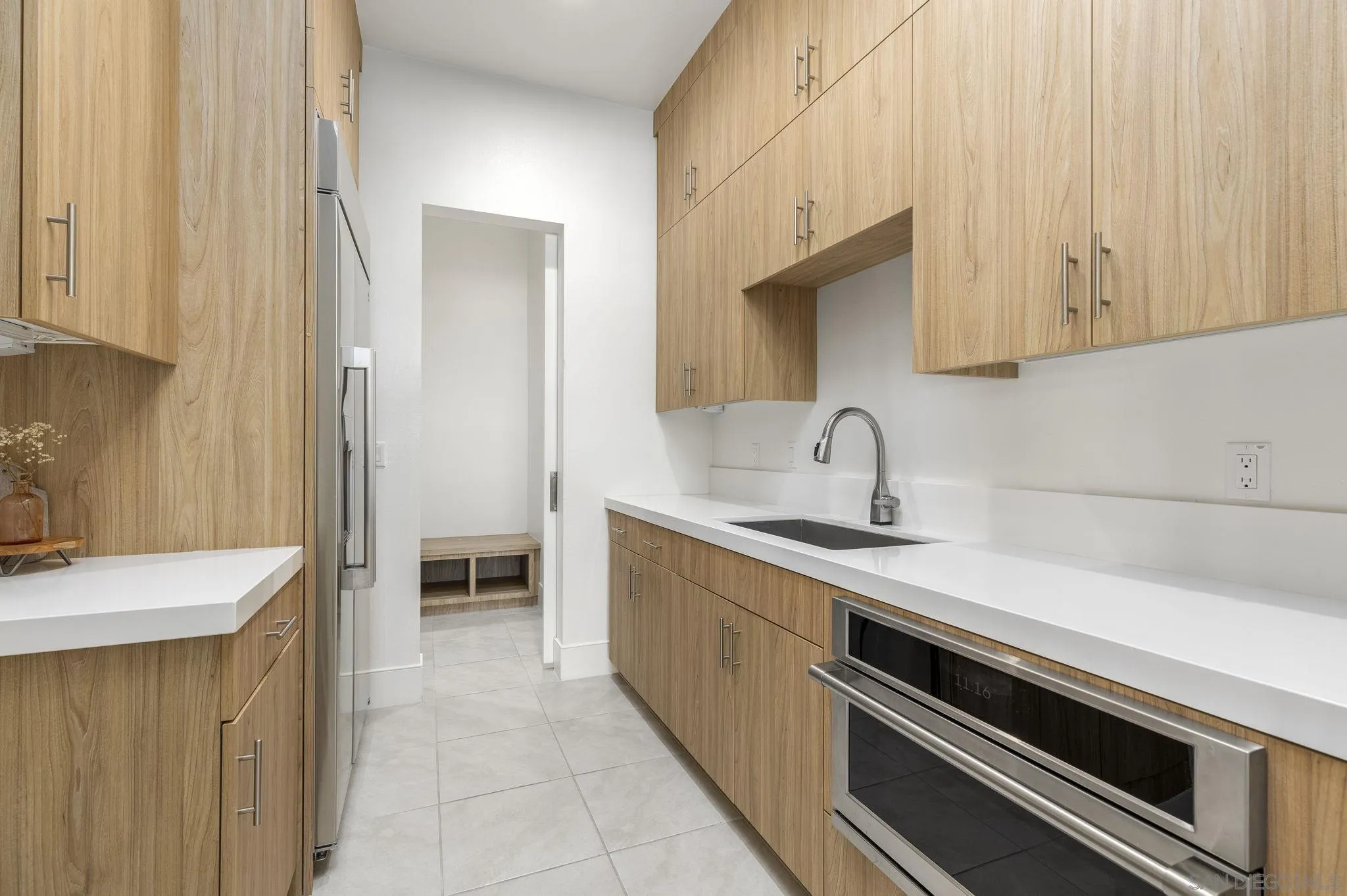 32213 Daybrook Terrace Temecula, CA 92591 - Photo 15 of 23 a kitchen with a sink and cabinets