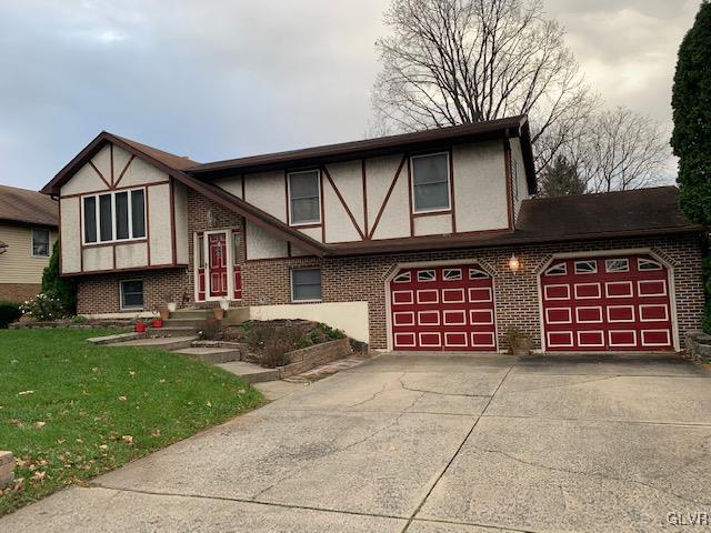 2718 Middletown Road Bethlehem, PA 18020 - Photo 2 of 2 a front view of a house with a yard and garage