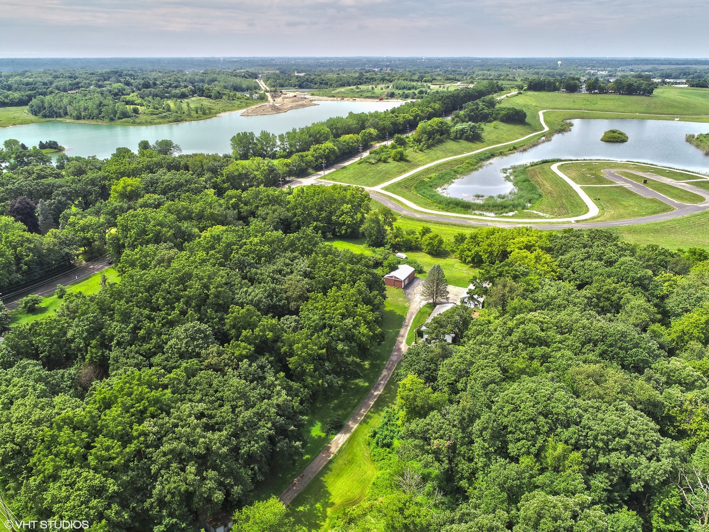 2204 Cary Road Algonquin, IL 60102 - Photo 4 of 9 a view of a lake with a yard
