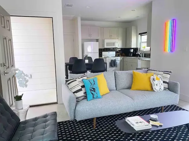 a living room with furniture and a rug