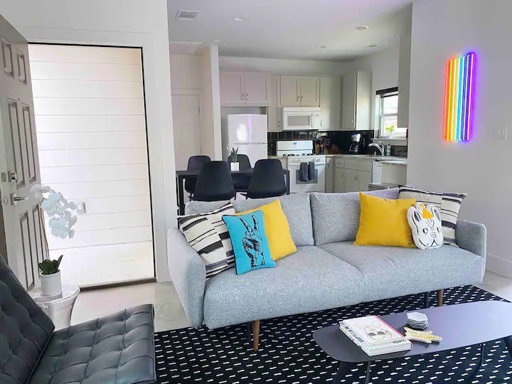 a living room with furniture and a rug