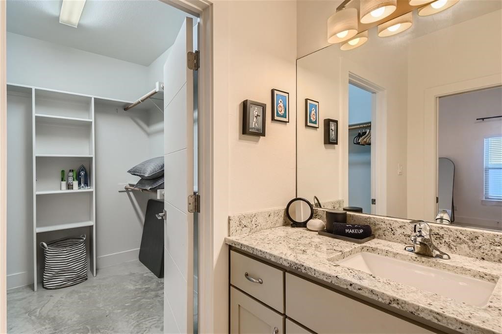 2012 Willow Street, Unit B Austin, TX 78702 - Photo 12 of 15 a bathroom with a granite countertop sink and a mirror