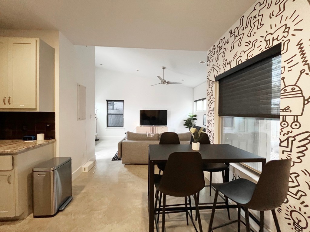 2012 Willow Street, Unit B Austin, TX 78702 - Photo 9 of 15 a living room with furniture a flat screen tv and a fireplace