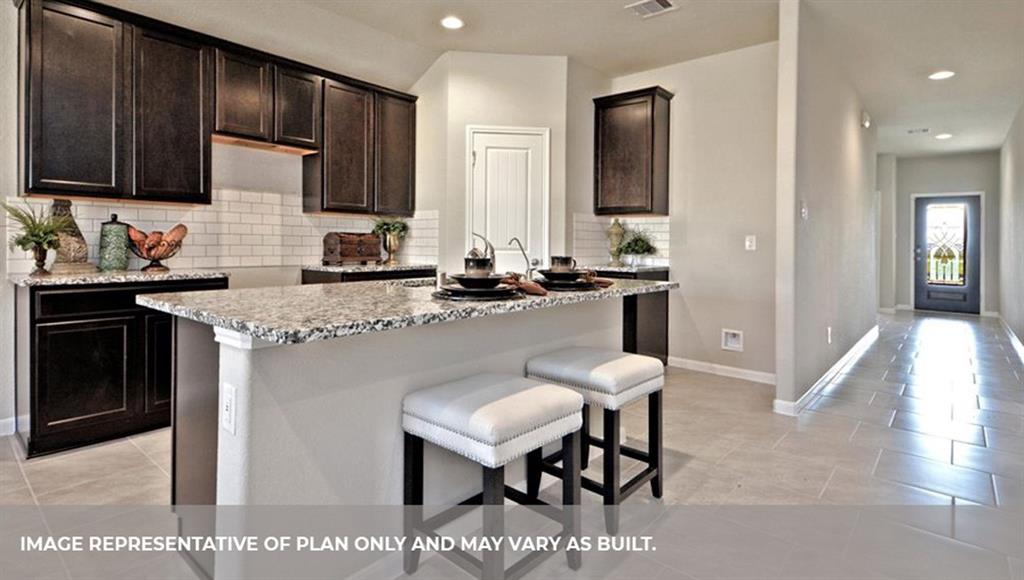 a kitchen with stainless steel appliances granite countertop wooden cabinets a sink stove and microwave