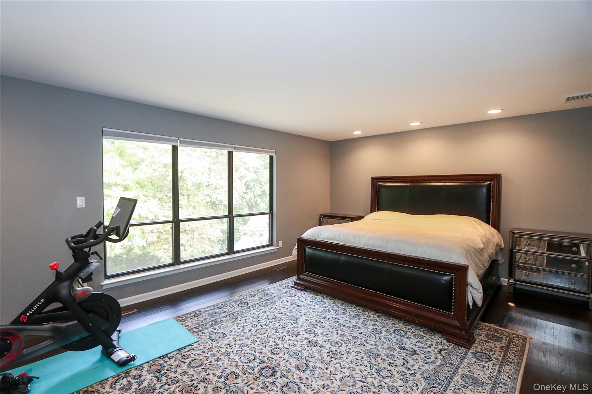 35 Old Pond Road Great Neck, NY 11023 - Photo 11 of 21 a bedroom with a bed and a large window