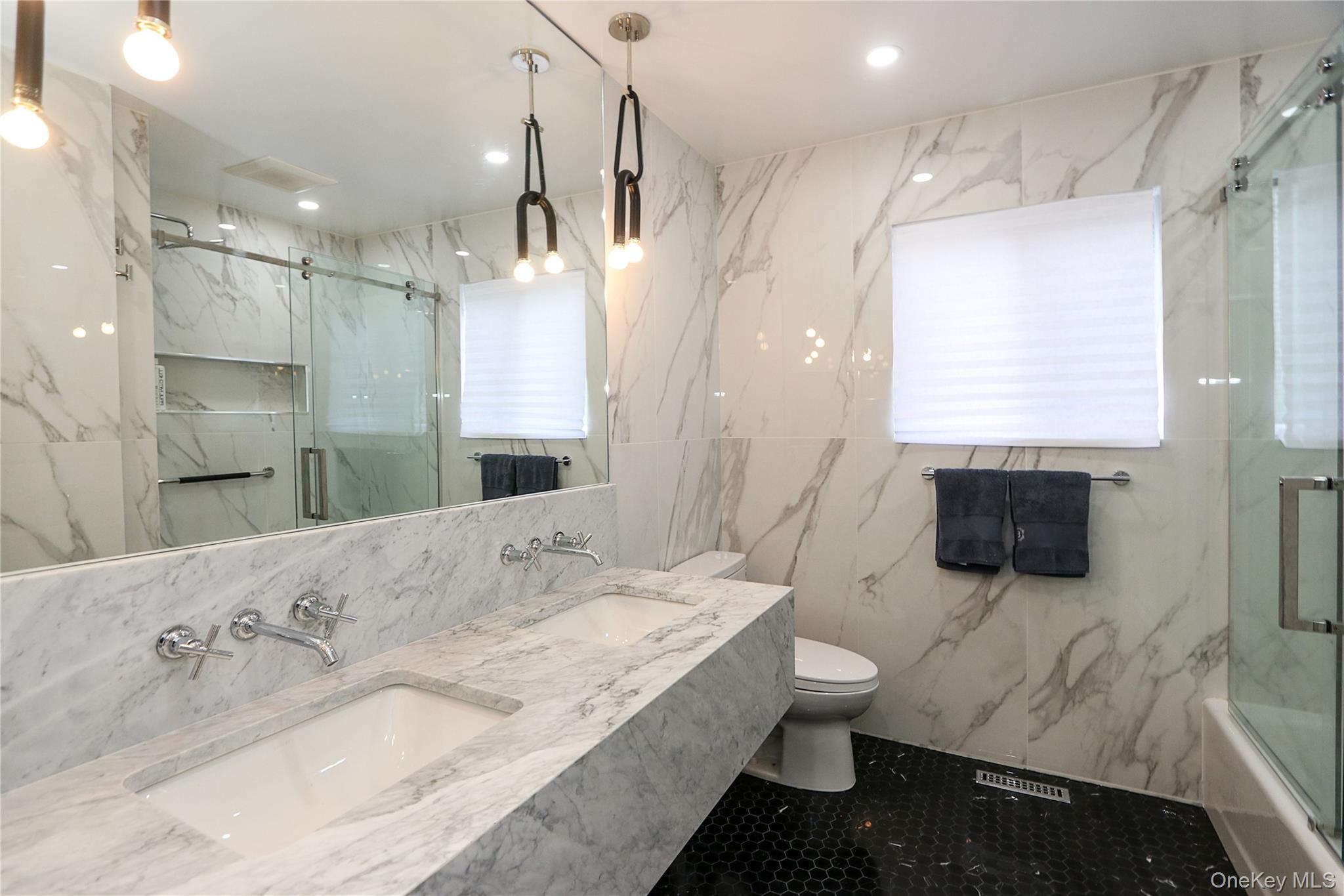 35 Old Pond Road Great Neck, NY 11023 - Photo 12 of 21 a bathroom with a granite countertop sink a toilet a mirror and shower