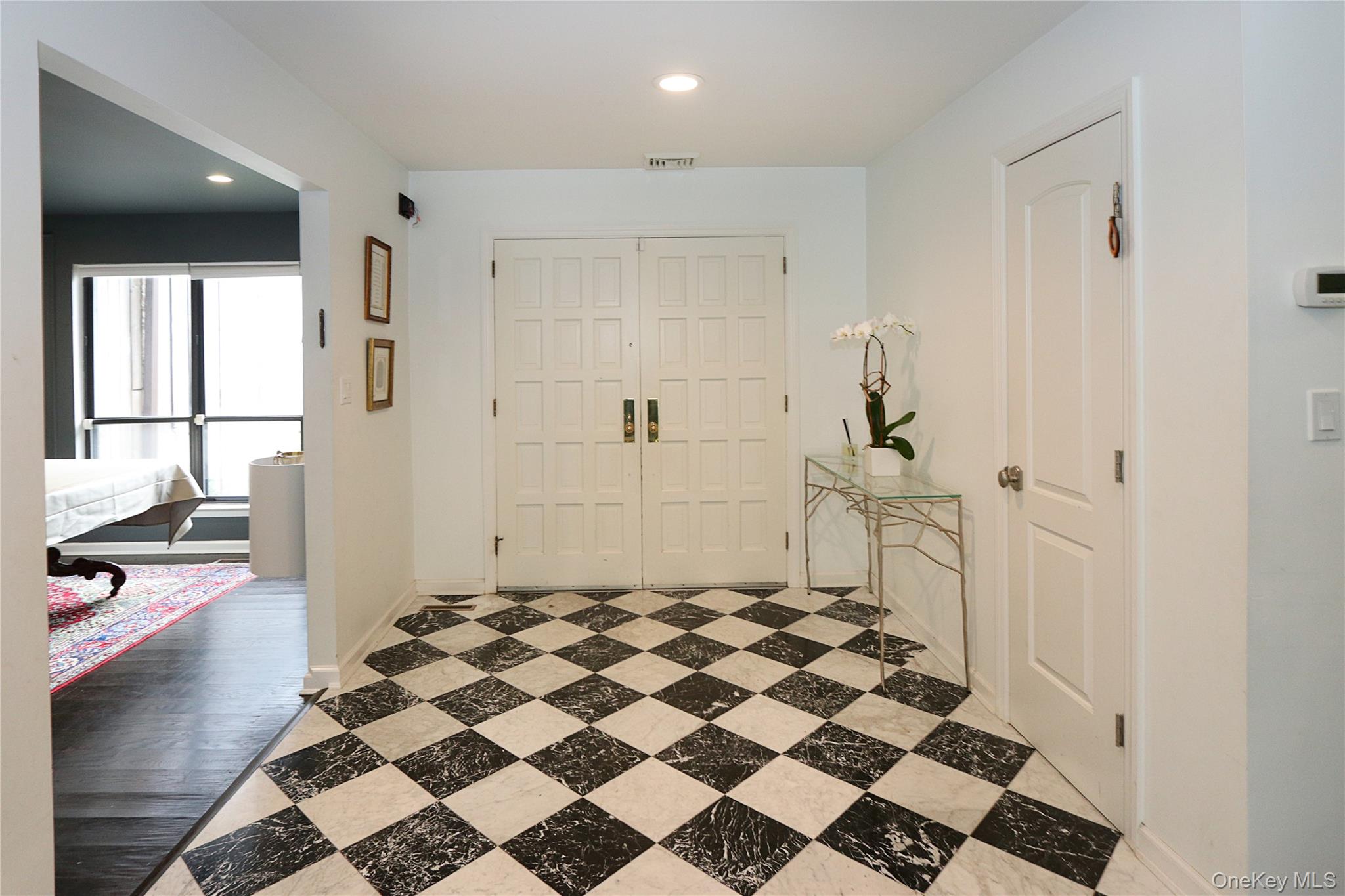 35 Old Pond Road Great Neck, NY 11023 - Photo 3 of 21 a bathroom with a checkered floor