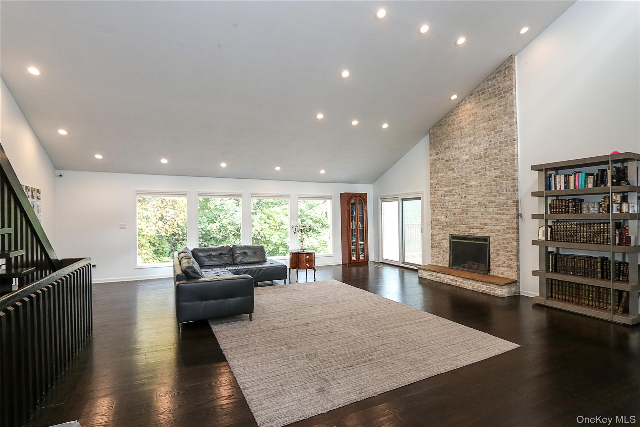 35 Old Pond Road Great Neck, NY 11023 - Photo 4 of 21 a living room with fireplace furniture and a flat screen tv