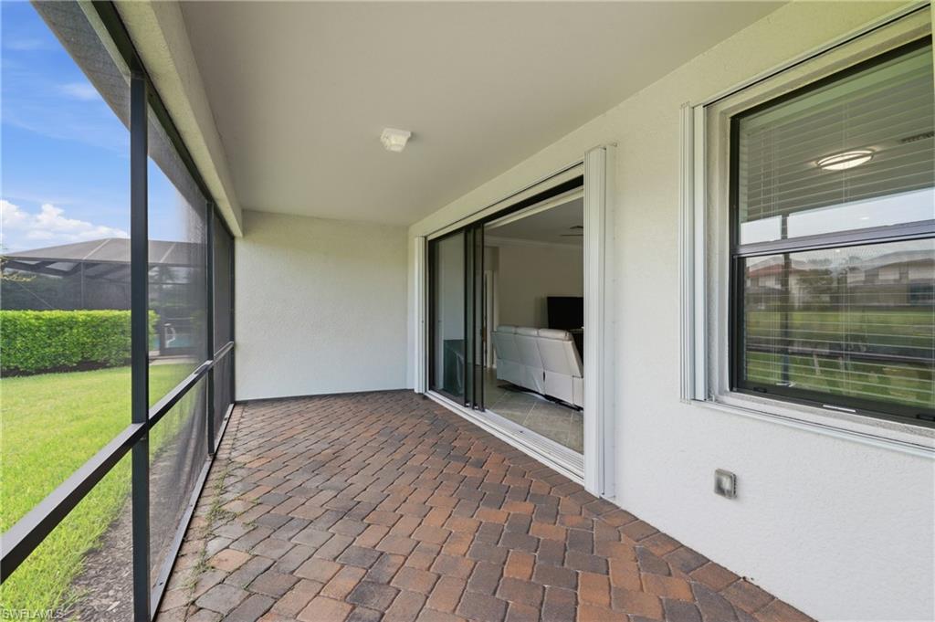 4374 Bismark Way Naples, FL 34119 - Photo 29 of 49 Screened lanai featuring multi-tone paver flooring